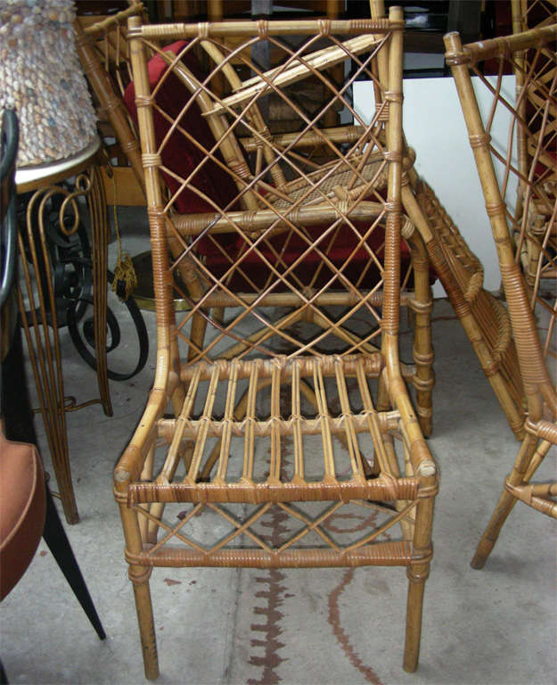 Louis Sognot pair of rattan chair in good rattan condition.
