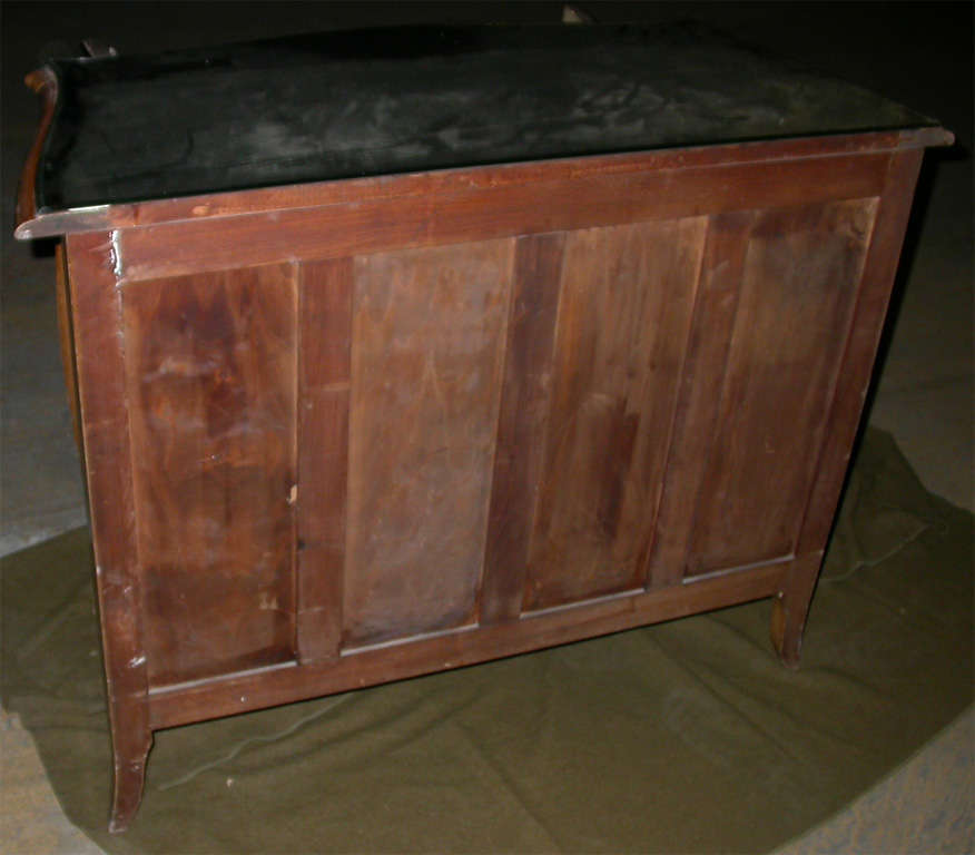1950s mirror-clad buffet, with stained wood structure and one interior shelf. Top surface has curved sides and front and is decorated in the guilloché technique. Length of the front, without the curves: 96 cm. Total length is given below.