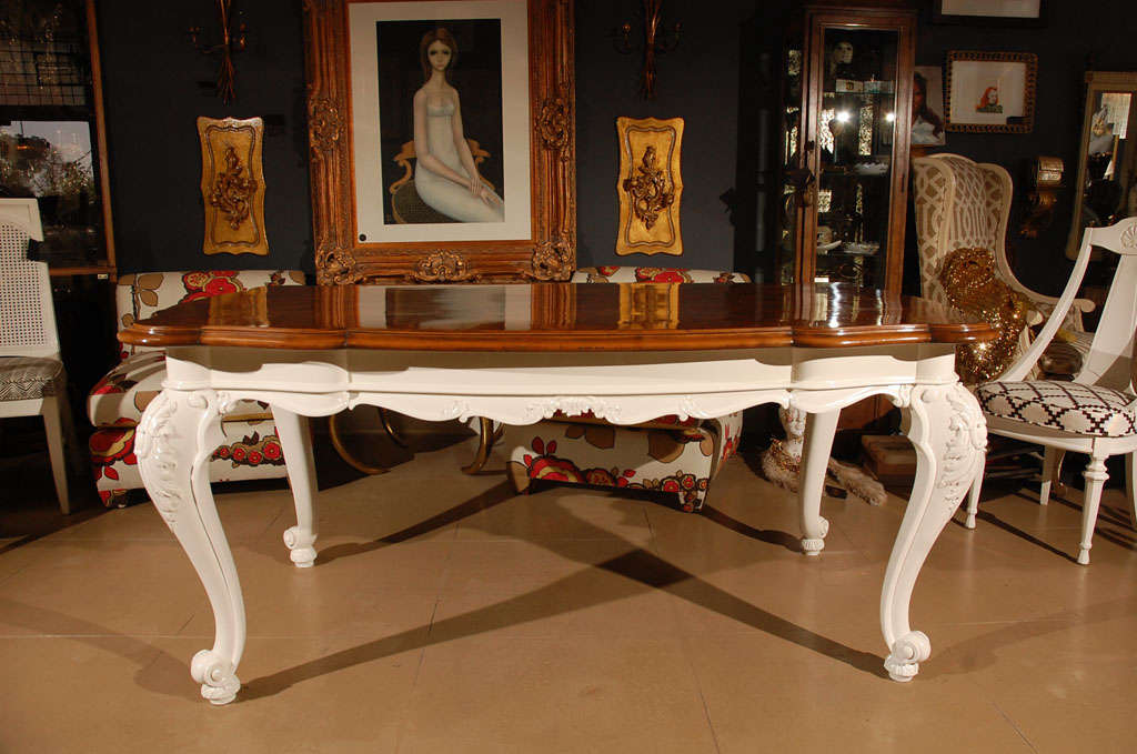 French Rococo style dining table with burled wood top and newly lacquered carved base