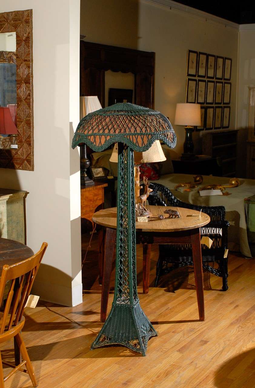 This is a lovely American wicker lamp with the original wicker shade.  This lamp is a wonderful piece of Americana.

Please visit our website for more pieces.
www.dearingantiques.com
Dearing Antiques was established in 1977.