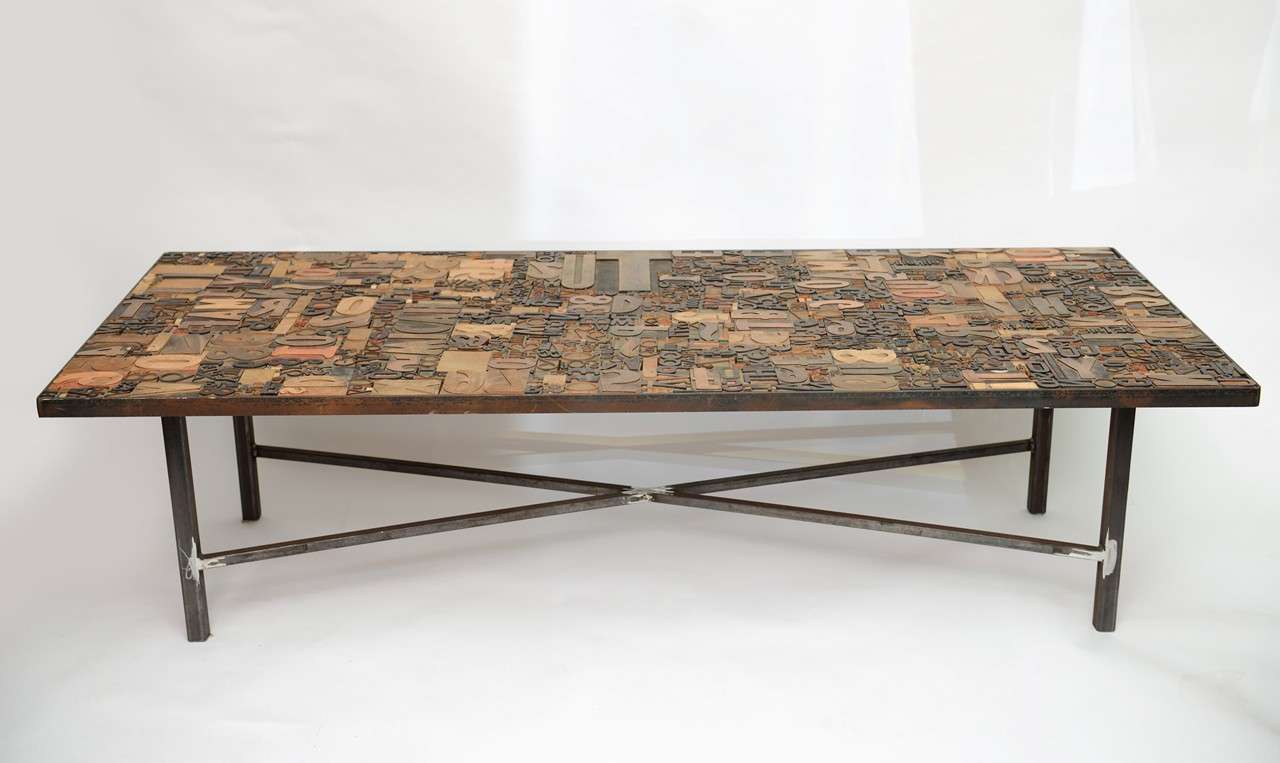 Vintage block letter type face coffee table with contemporary iron base.