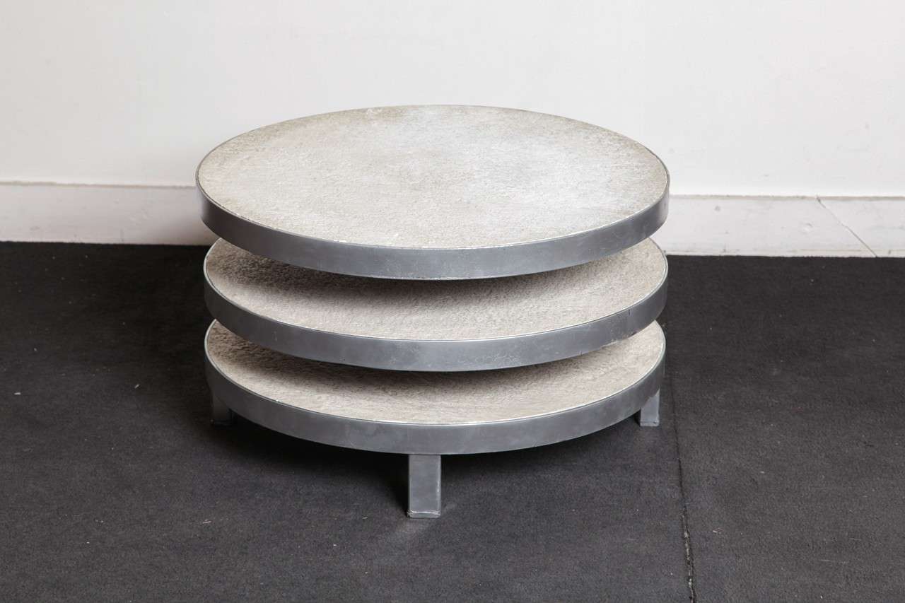 Elegant triple tiered coffee table circa 1970 , France.
Steel and plaster top on 4 steel legs.