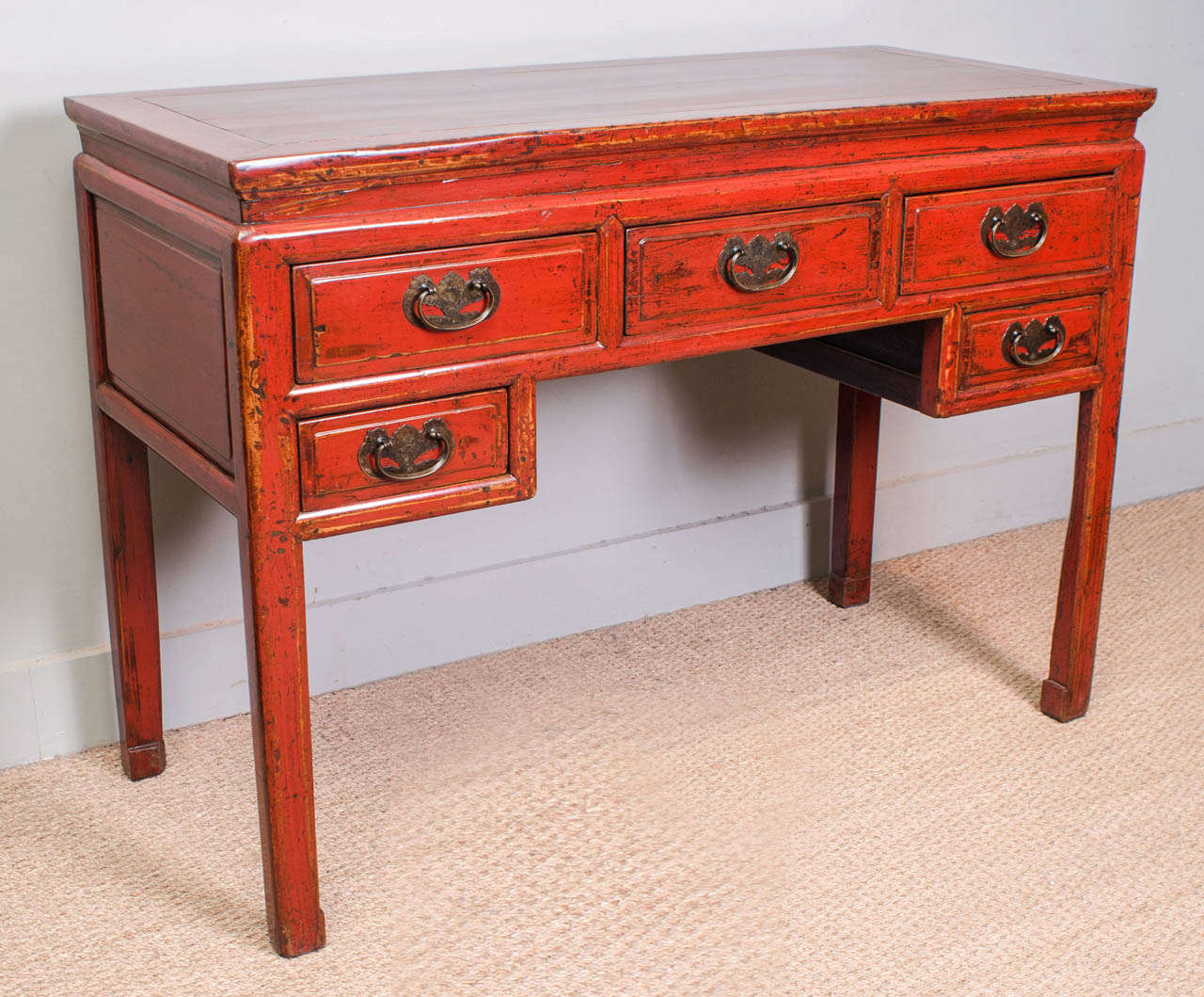 Red lacquer desk with five drawers and traditional bronze hardware. Mortice and tenon construction and beautifully finished on all sides. Suzhou, China.