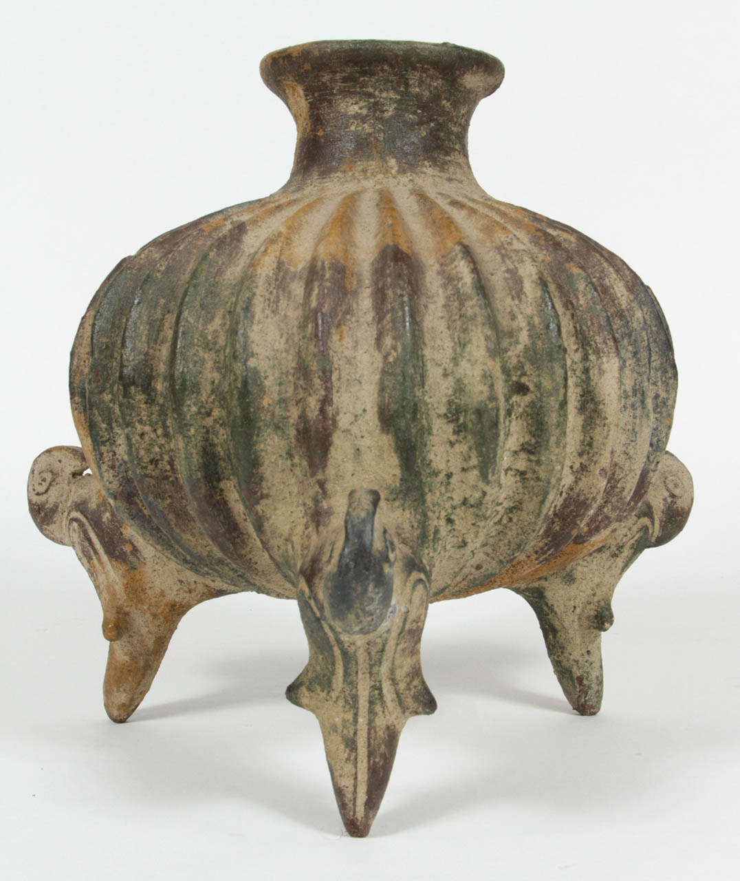 Pottery vessel with three decorative bird shaped legs.