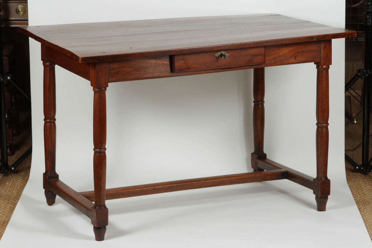 Single drawer, with key.  Turned legs and stretcher.  French, circa 1850.