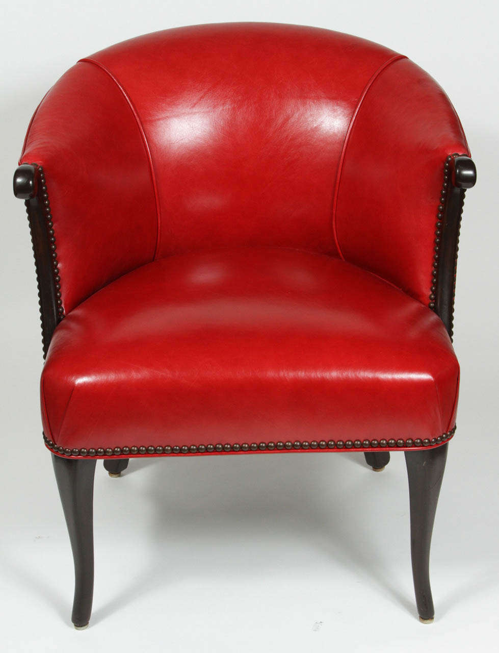 Vintage barrel chair. Newly refinished and upholstered in new red leather with nail heads.