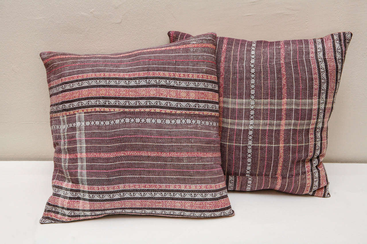 Purple and rose stripe design with subtle embroidered gold detail on front. Rose plaid hand woven Indian khadi cotton on back. Kantha quilts are made from old cotton saris. Hidden zipper enclosures. Feather and down fill. Priced individually at $425