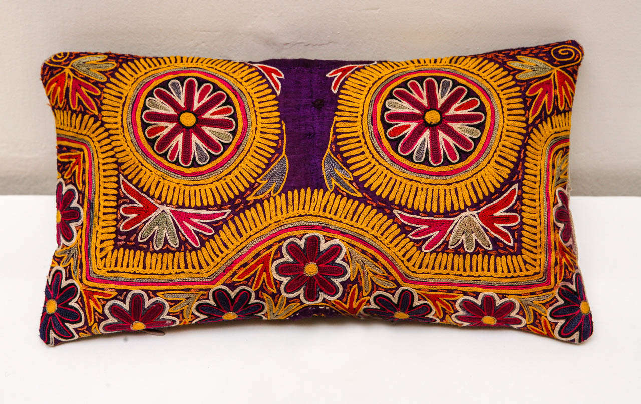 Richly colored silk pillow with intricate gold, magenta, and bright pink/orange silk embroidery. Made from Indian choli. Natural colored linen back. Hidden zipper enclosure, feather & down fill.