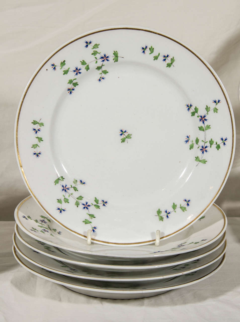 An early 19th century Derby dessert service decorated with a traditional design of cornflower sprigs. Porcelains decorated with a design of cornflower sprigs originated in the 18th century with porcelains made for Queen Marie Antoinette of France.