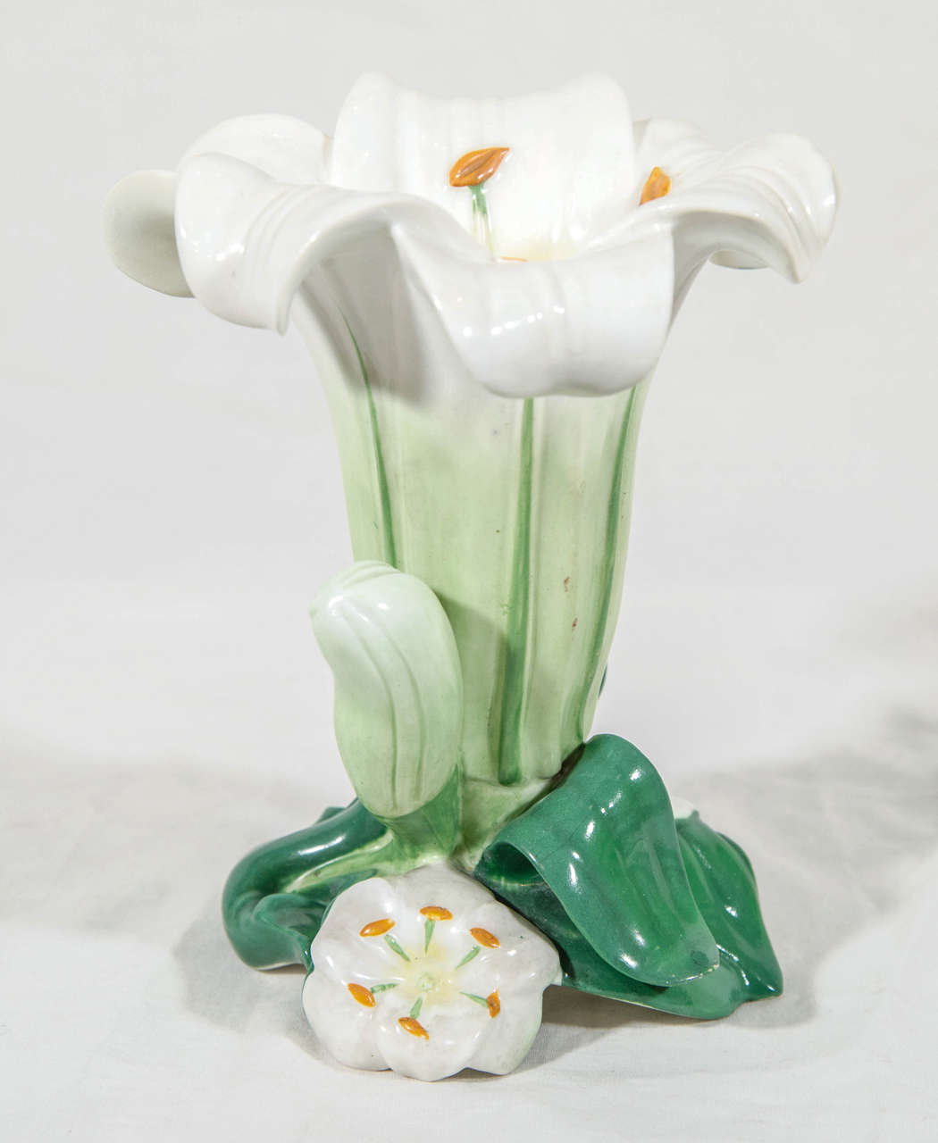 A pair of mid-19th century Minton porcelain vases in the form of lilies. They are lifesize and naturalistically modeled.