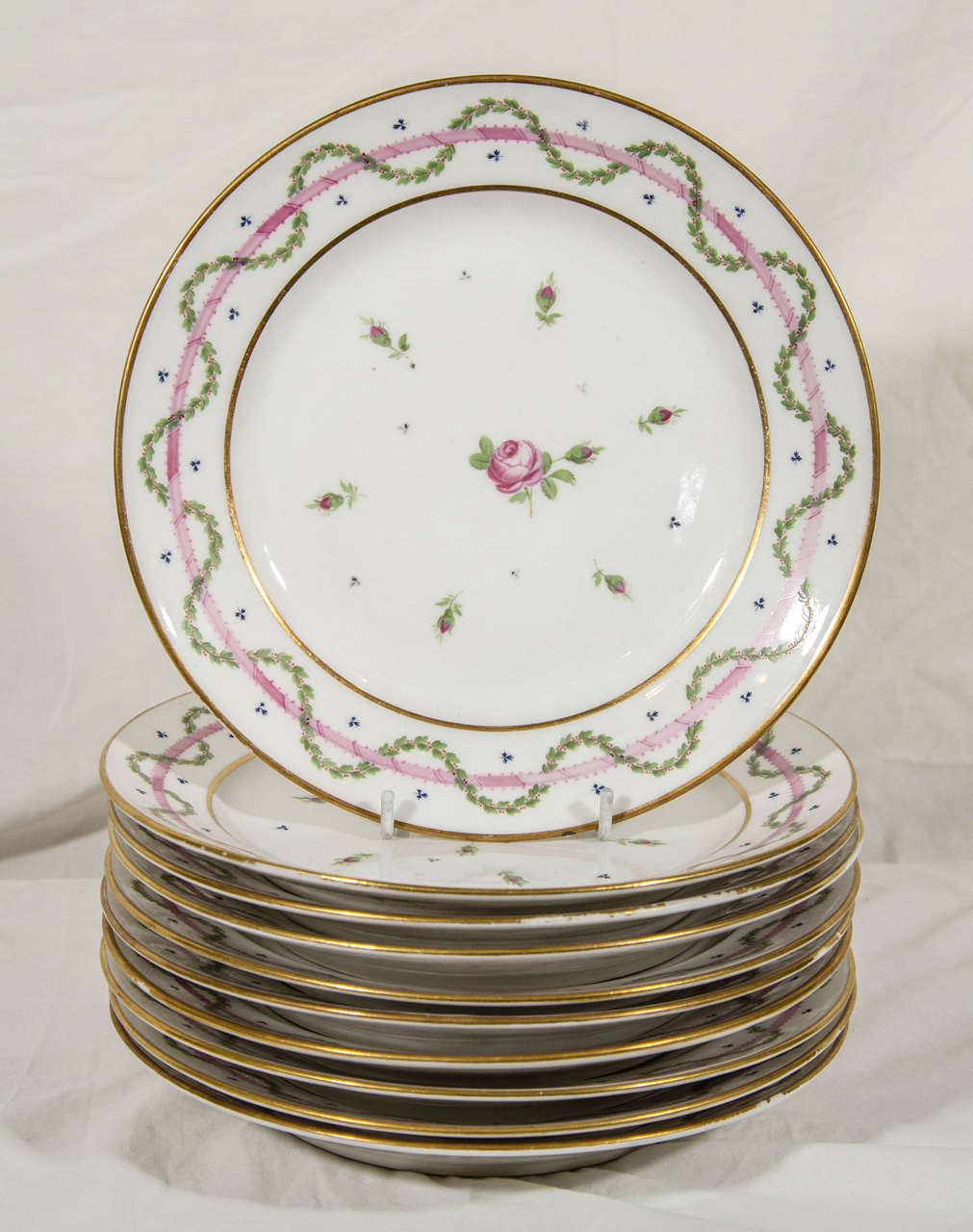 Known for its elegant design, Lebon Halley porcelains featured floral designs painted in soft colors such as the pink and green in these dishes.* Charles Halley began the manufacture of fine porcelains in Paris during the last decade of the 18th