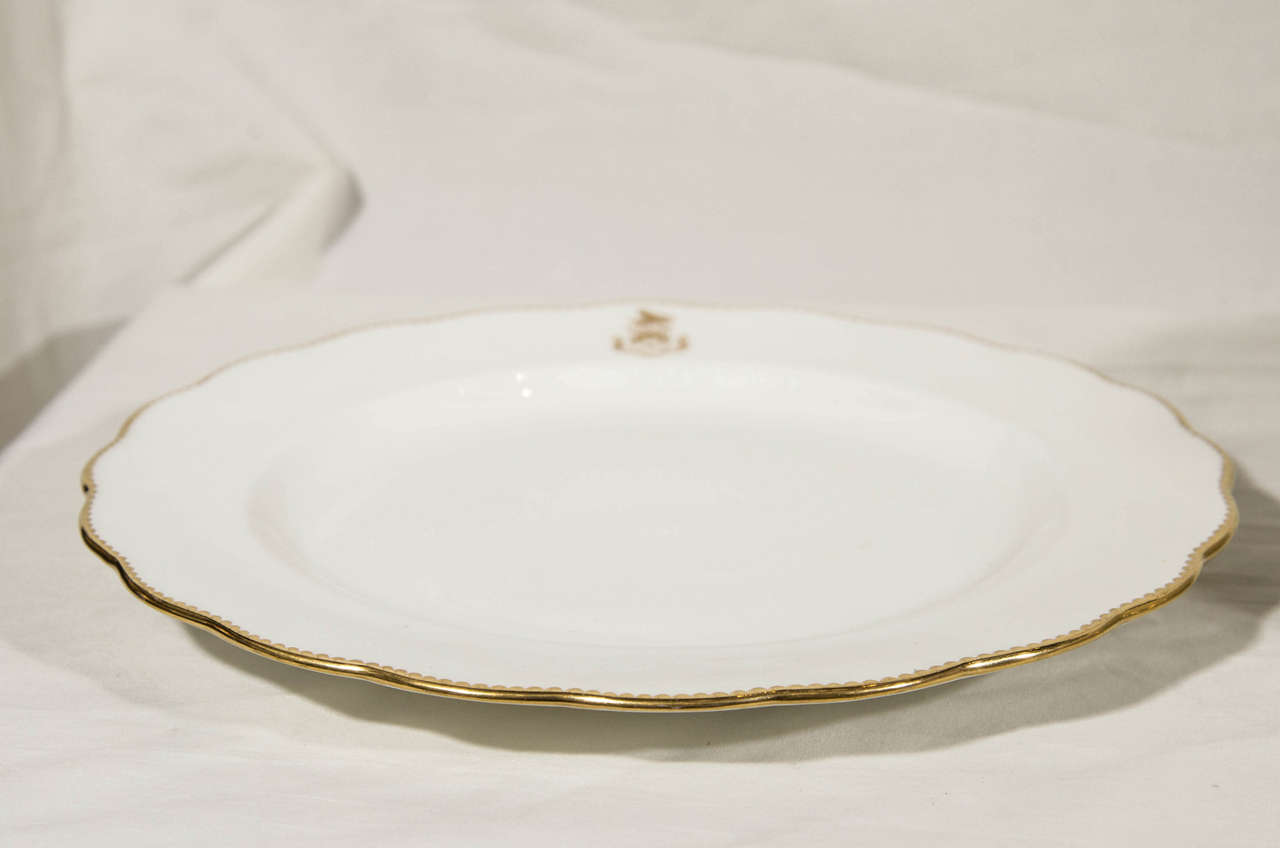 English Set of 12 White and Gold Armorial Dinner Dishes with the Motto: Toujours Fidele