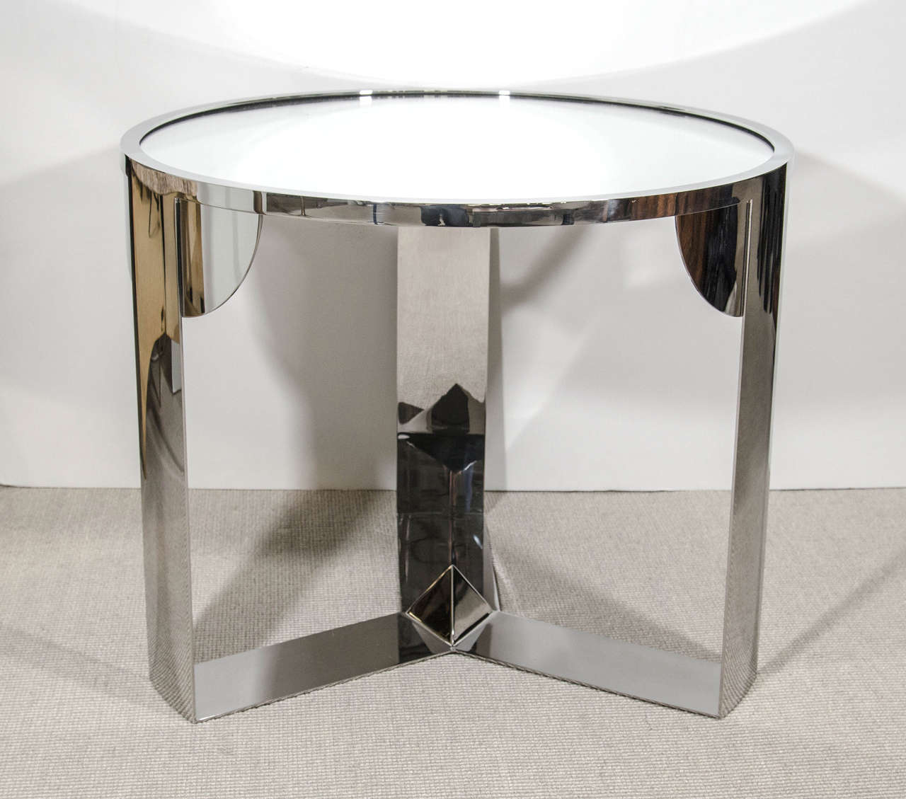 Limited edition constructivist inspired custom-made table by Eric Appel, USA.
Mirror top and polished stainless nickel finish base with pyramid design.

Other combinations available.
