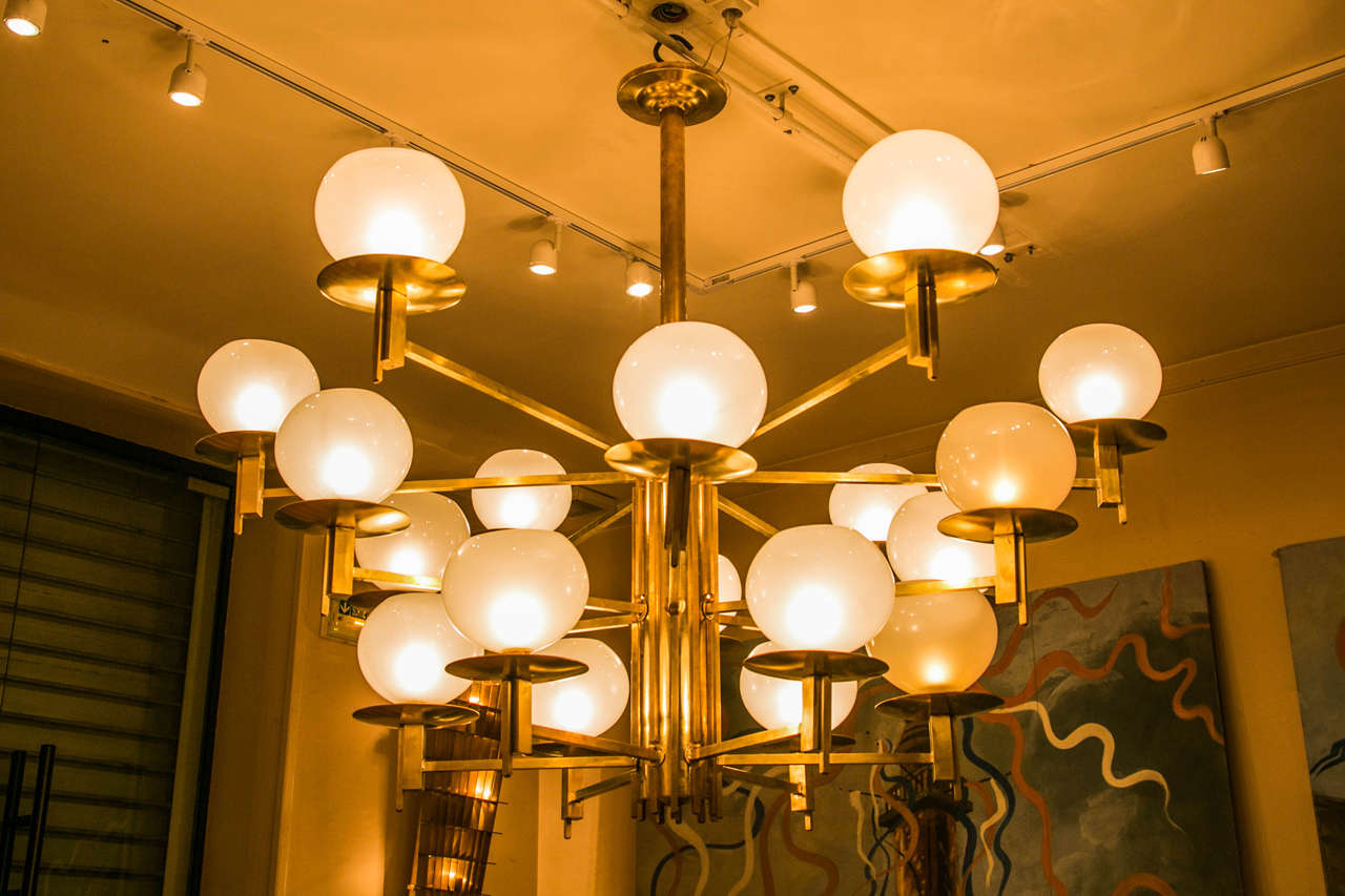 Large Italian chandelier, brass fixture and 18 opaline glass globes by Studio Glustin.