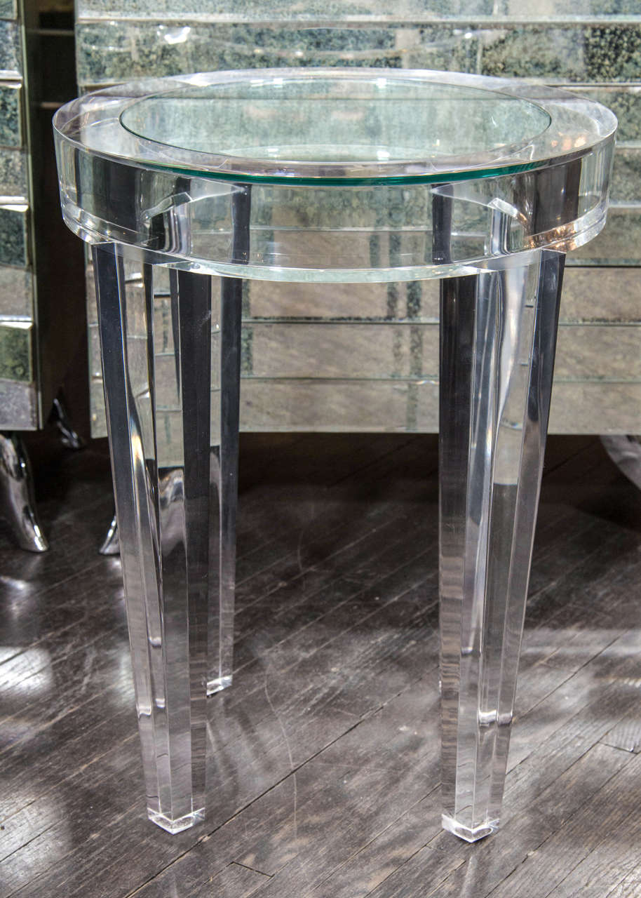 Round acrylic side table with glass insert.