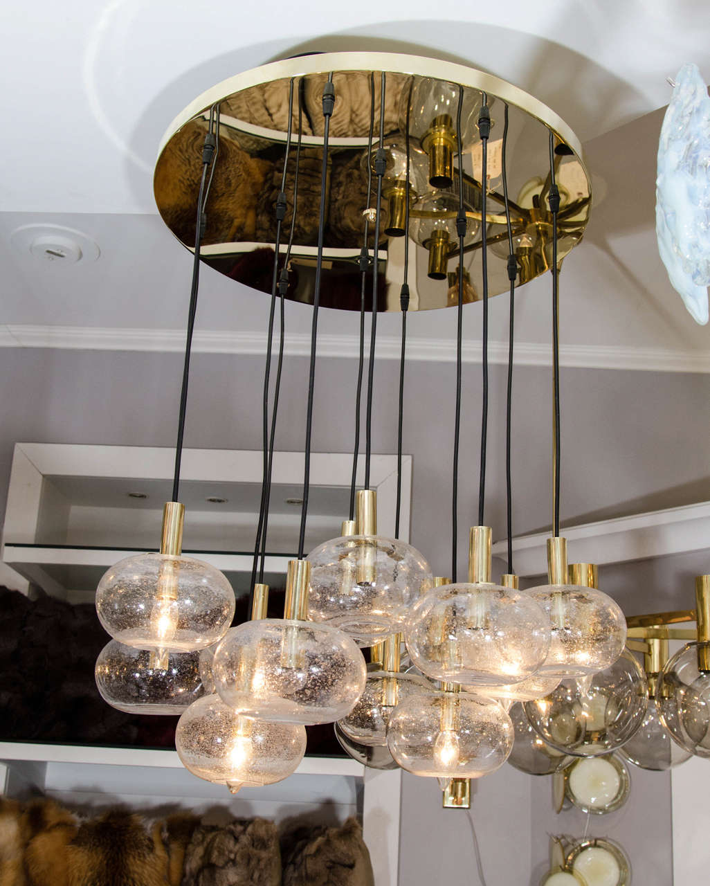 Custom twelve-oval globe chandelier. Customization is available in different sizes and finishes.
