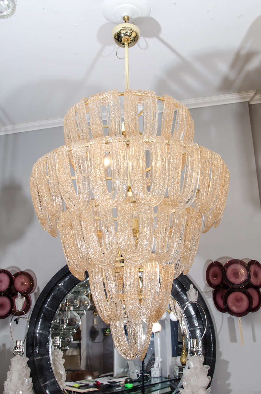 Large Mazzega chandelier with gold leaf Murano glass.