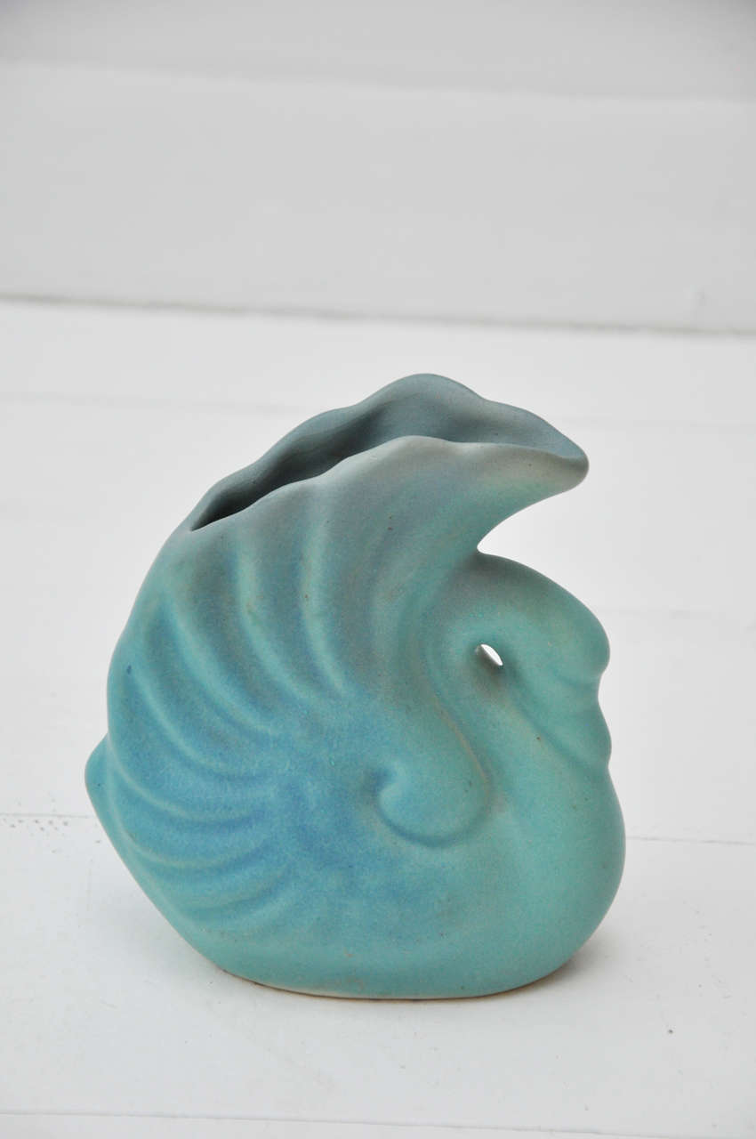 Authentic Van Briggle pottery vase with swan design in signature matte turquoise glaze.  Signed and marked with 