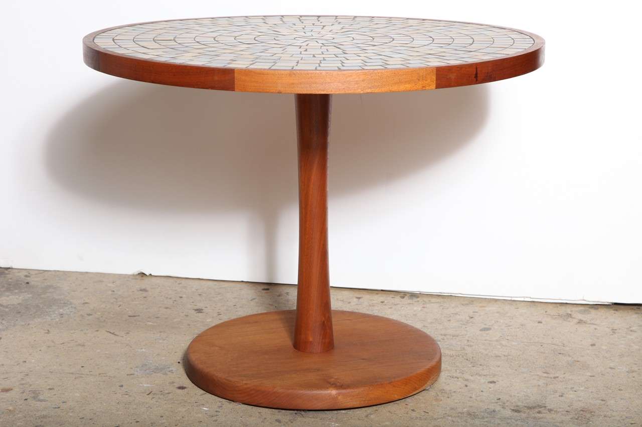 Jane and Gordon Martz for Marshall Studios TOI-28 Walnut & Ceramic Tile Round Table. Featuring a round oiled Walnut frame, 20H tulip shaped pedestal column and round base with natural, neutral toned Dark Olive Green and Pale Mustard square ceramic
