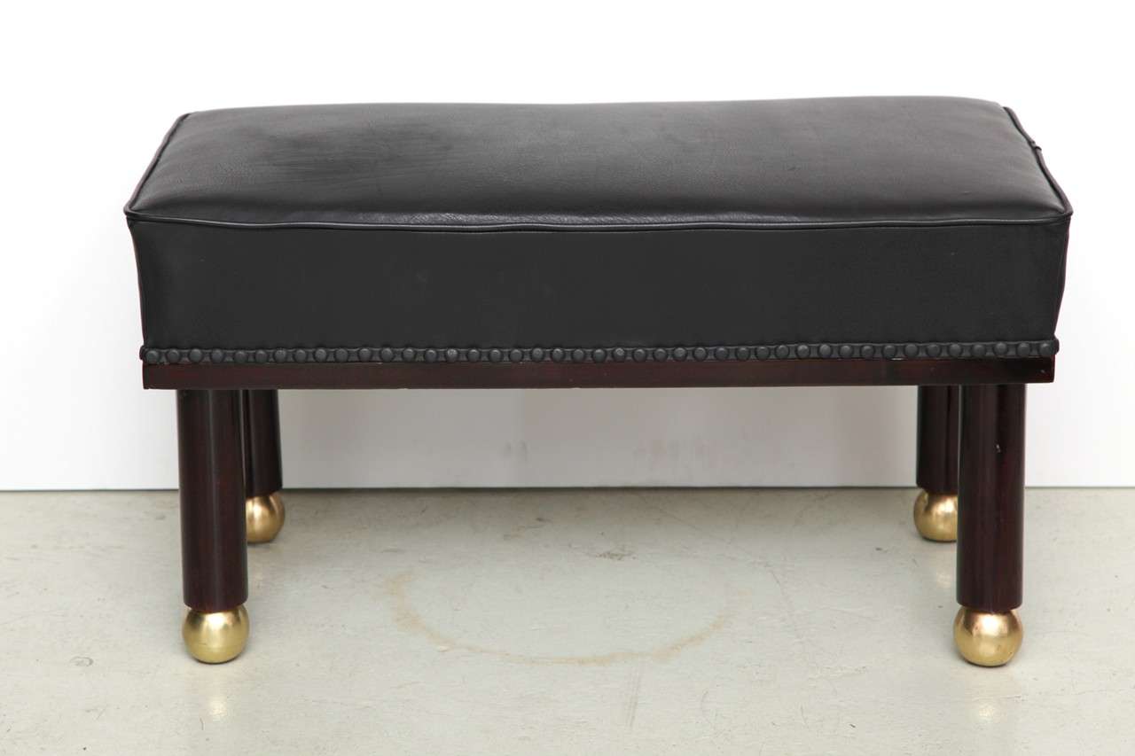 Viennese bench with leather upholstery and brass feet, c. 1920.