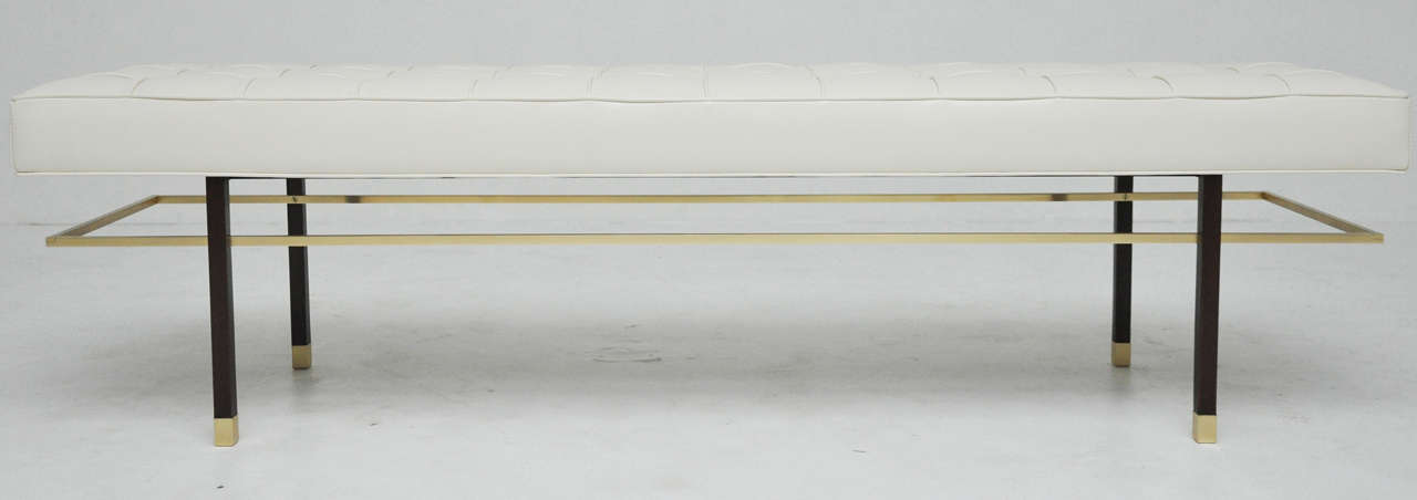 6ft bench by Harvey Probber.  Newly upholstered in ivory leather.  Fully restored and refinished brass and walnut frame.
