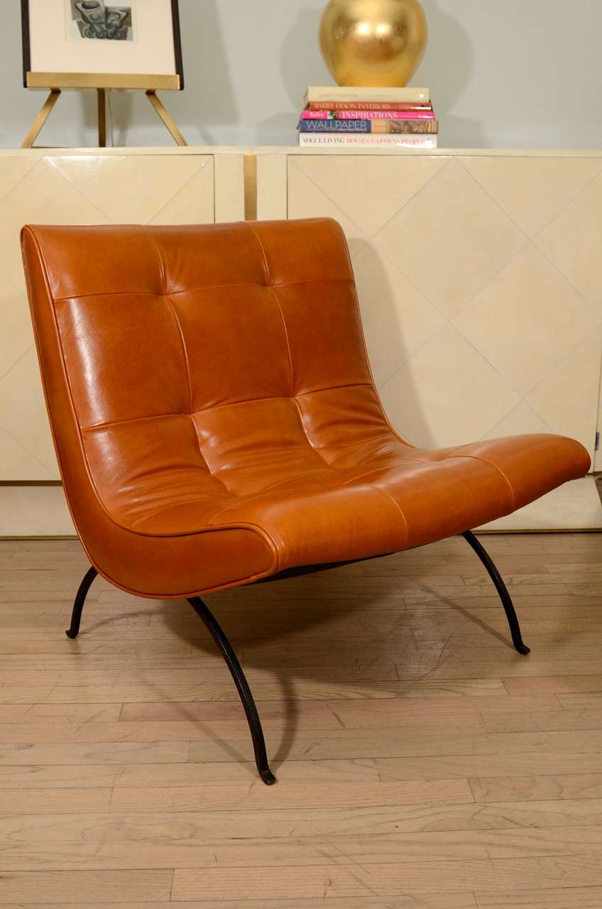 Milo Baughman tufted slipper chair and ottoman in leather with iron base. 
