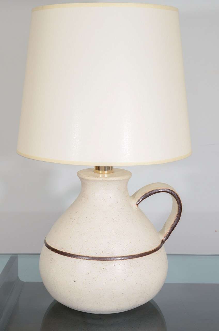 Guido Gambone ceramic lamp with brass hardware. Carefully detailed & in perfect condition. Shade is new and open to customization: size, color, etc..
Signed . 