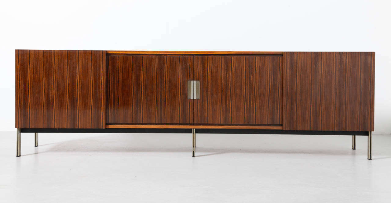 Characteristic large sideboard designed by the Coene  Fréres for Knoll  International, Belgium,1960s.
This large sideboard a marvelous quality and features four sliding doors, behind four of them is one shelve. Mint condition.