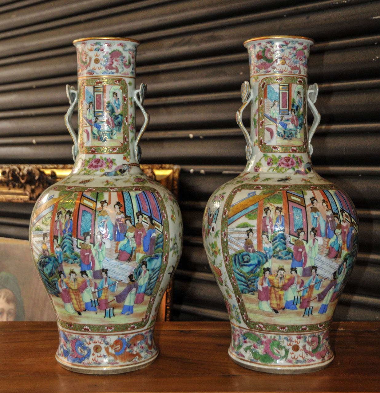 19th Century pair of large polychrome earthenware Cantonese (China) vases. Ruyi shape handles. Very good condition. Normal wear consistent with age and use.