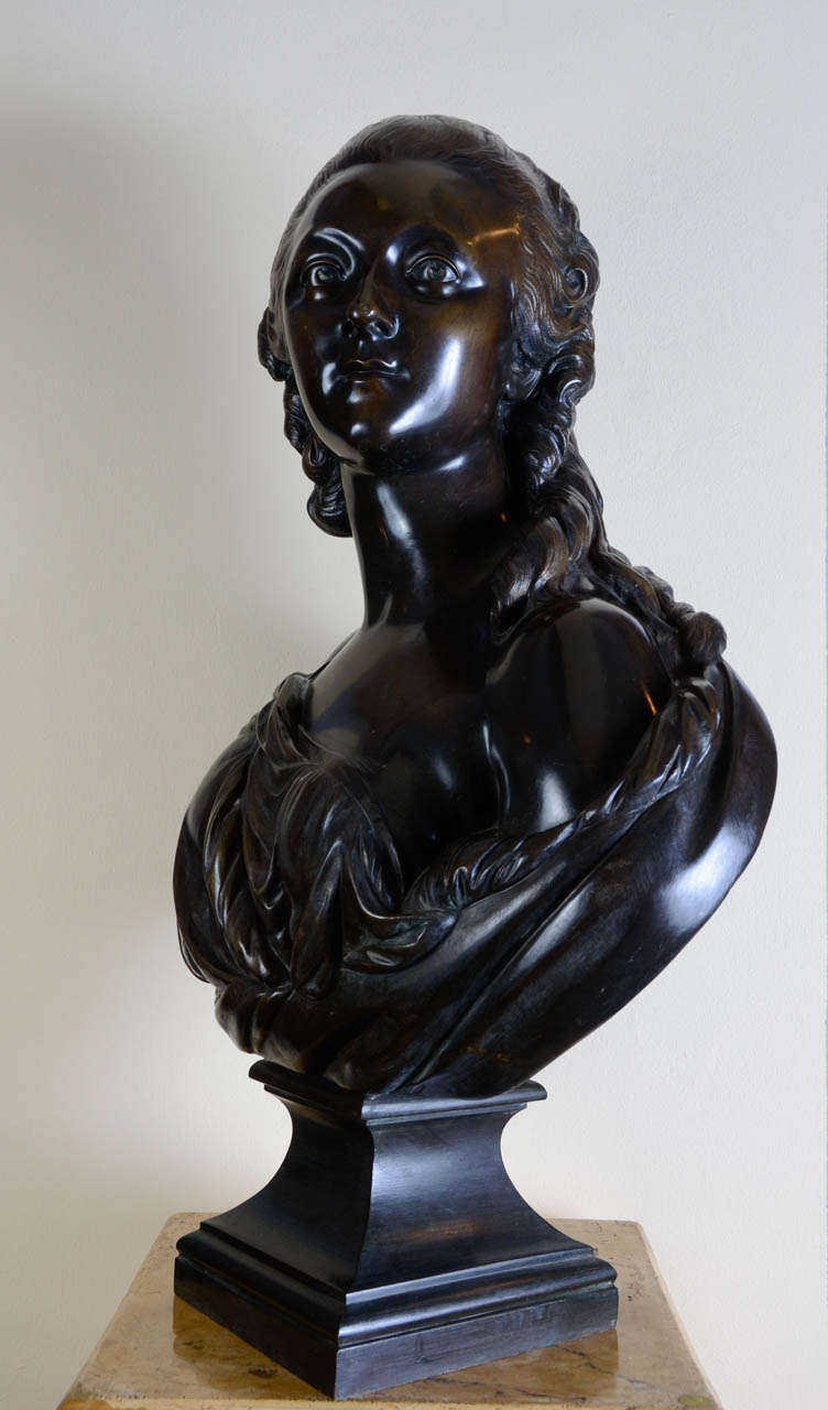 Bronze bust in the style of Augustin PAJOU (1730-1809). Bust portrait of Madame du Barry. Stands on a molded piedouche base.