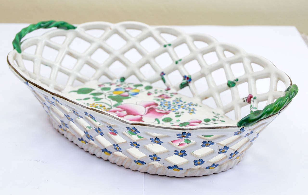 Oval polychrome porcelain basket, blooming decor and laced basketry porcelain. Joseph Hannong brand monogram under the base.