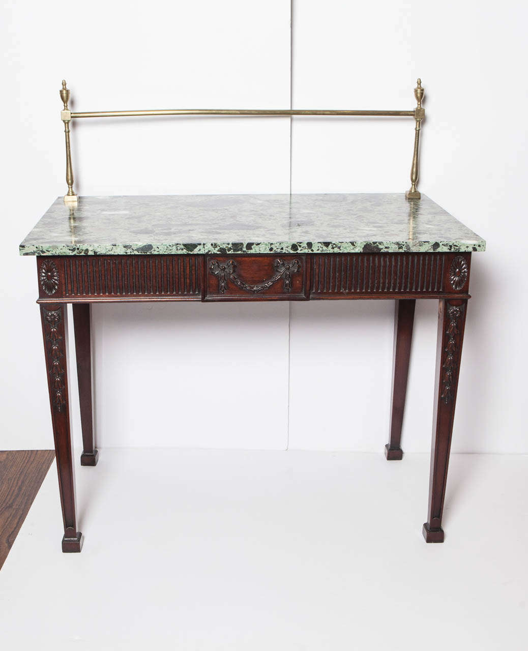 Carved mahogany sideboard has green and black marble top and brass butler's railing. Brass railing is an additional 13.25