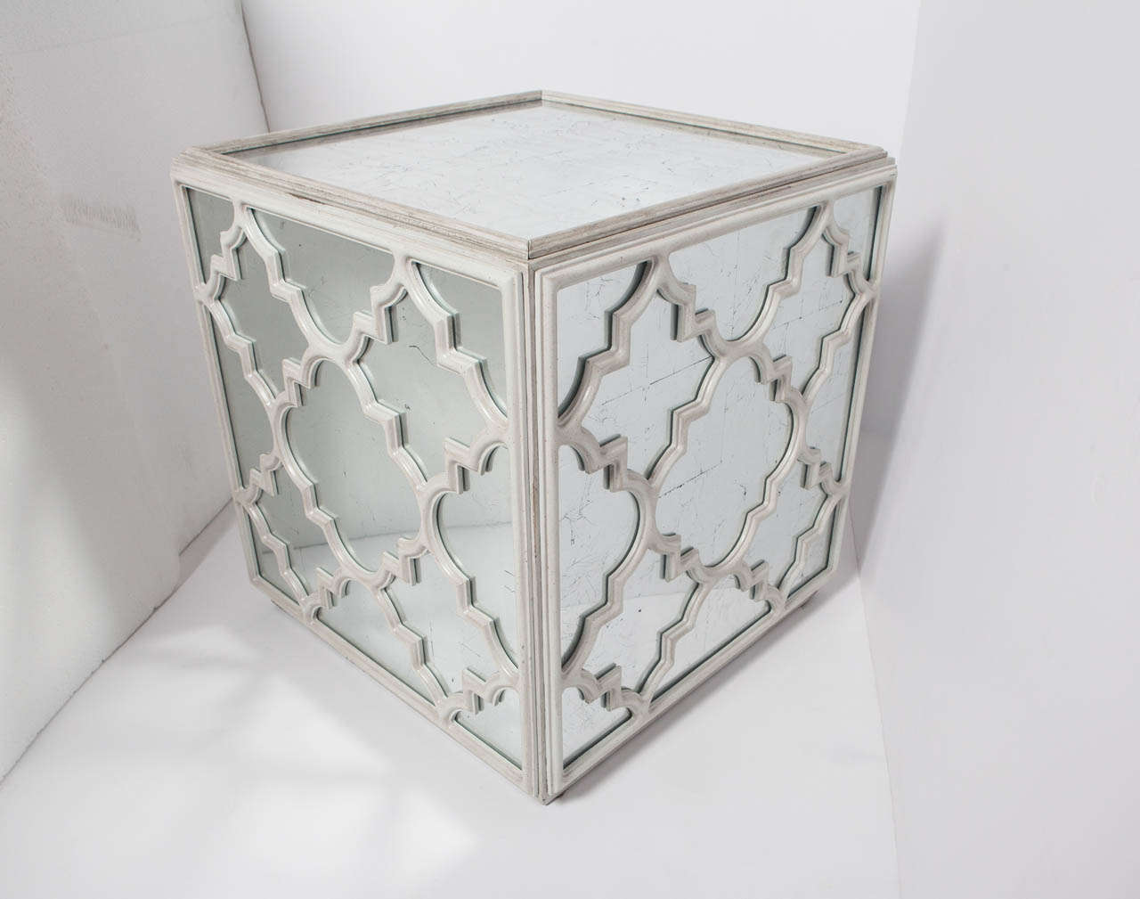 Distressed mirror and wood fretwork cube can be used as occasional, coffee or end table. Mirror is on top and four sides of cube.