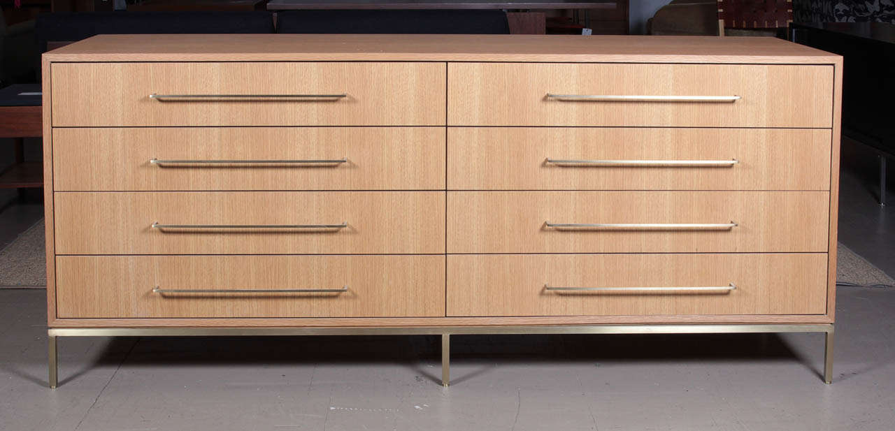 Sleek double dresser from ReGeneration's new line.
White oak with satin brass handles and base.