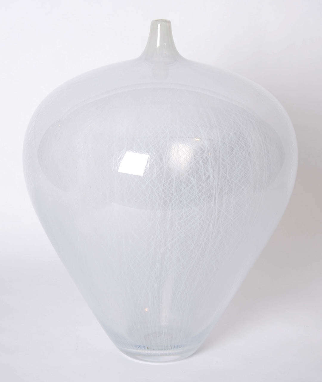 Handblown unique artwork by Vidar Koksvik. Tall clear crystal rounded bottle with thin and intricate white filigree cane pattern.