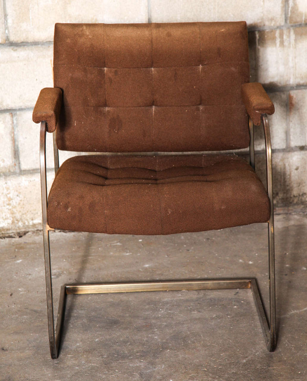 Store closing-- last day is 7/31. Offers welcome! Mid-Century flat bar cantilevered chair in bronze-plated steel. Made by Patrician Furniture Company and signed with tag to underside. Needs new upholstery.