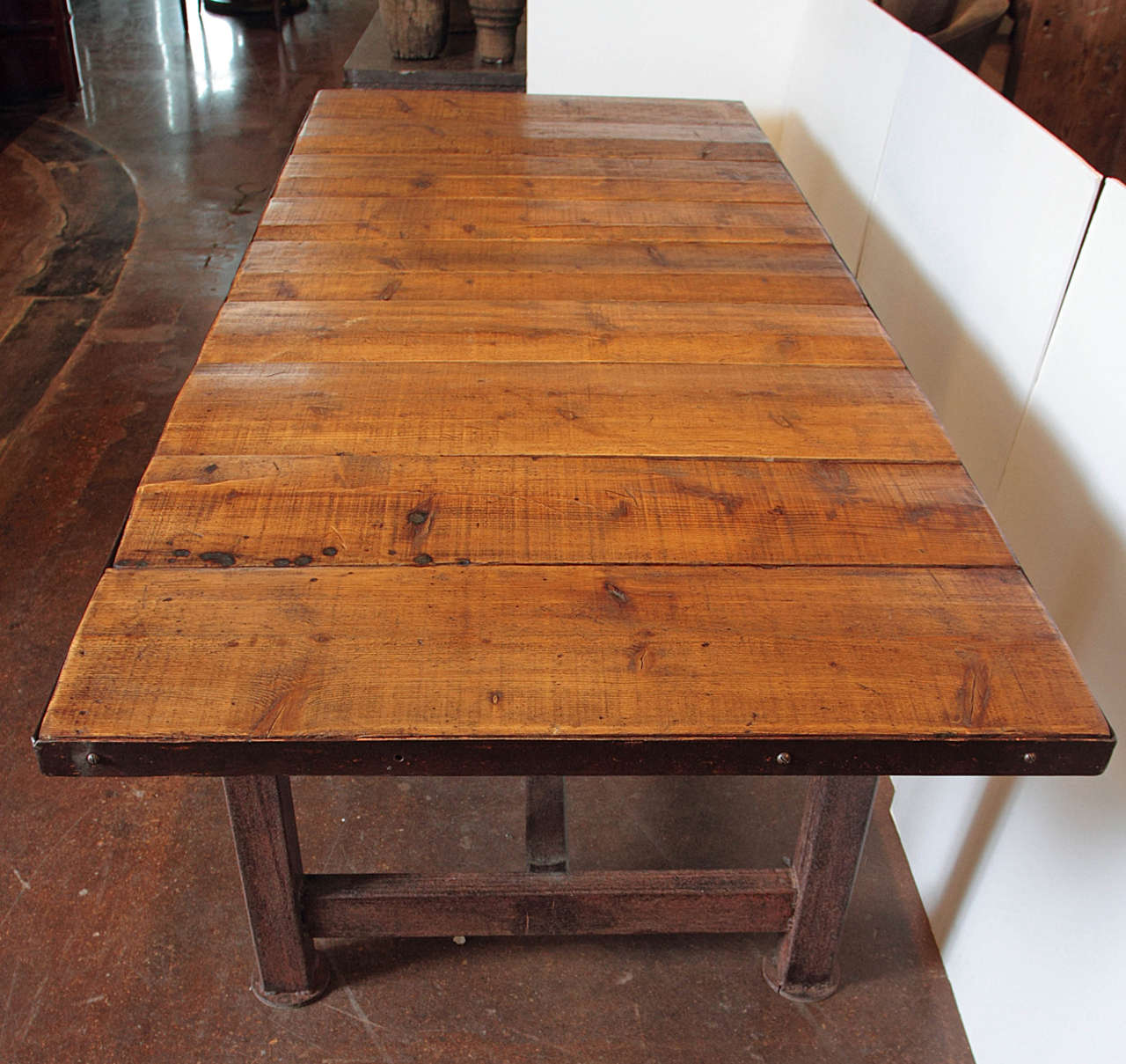 Reclaimed Vintage Industrial Inspired Dining Table made from Reclaimed Elements:
On the tag engraved on this dining table saids 