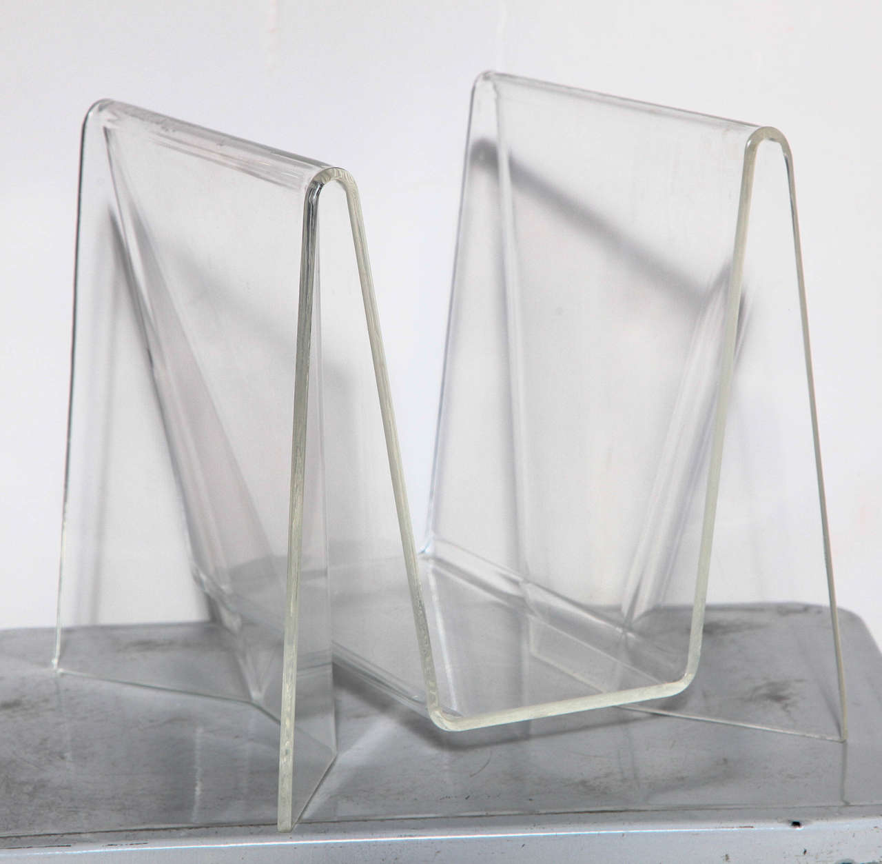 Neal Small Repolished Transparent Lucite Magazine, Storage Stand. Sculptural. Lightweight. Versatile. Sturdy. Rarity. Repurpose. Storage. Towels. Linen. Wood.  New York artist Neal Small specialized in Lucite, Mirror and Glass pieces.  His pieces