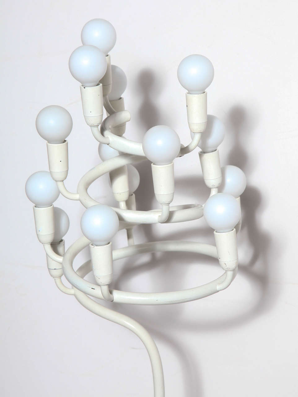 Scandinavian Modern Max Bill White Enameled Spiral Floor Lamp, 1960's. Featuring an off-white enameled metal tubular stem, spiral top highlighted with 14 frosted white glass candelabra bulbs on 8.5