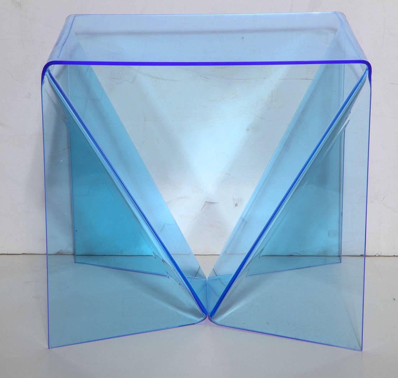 Classic pair Neal Small translucent Pale Blue Perspex Origami Tables, Side by Side Coffee Tables, End Tables.  While a New York artist, Neal Small specialized in Lucite, Mirror and Glass pieces.  His pieces are held in museum collections including