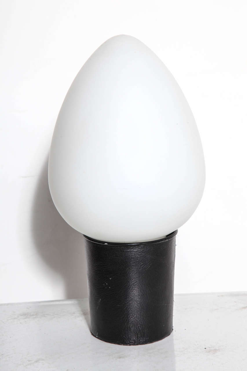 Laurel Lamp Company Pop Art Accent egg shaped Table Lamp. Featuring an egg shaped frosted white glass globe on cylindrical black leather covered base. Great Bookcase Lamp, Etagerè Lamp, Bedroom Lamp, Bathroom Lamp, Library Lamp, Study Lamp, Entryway