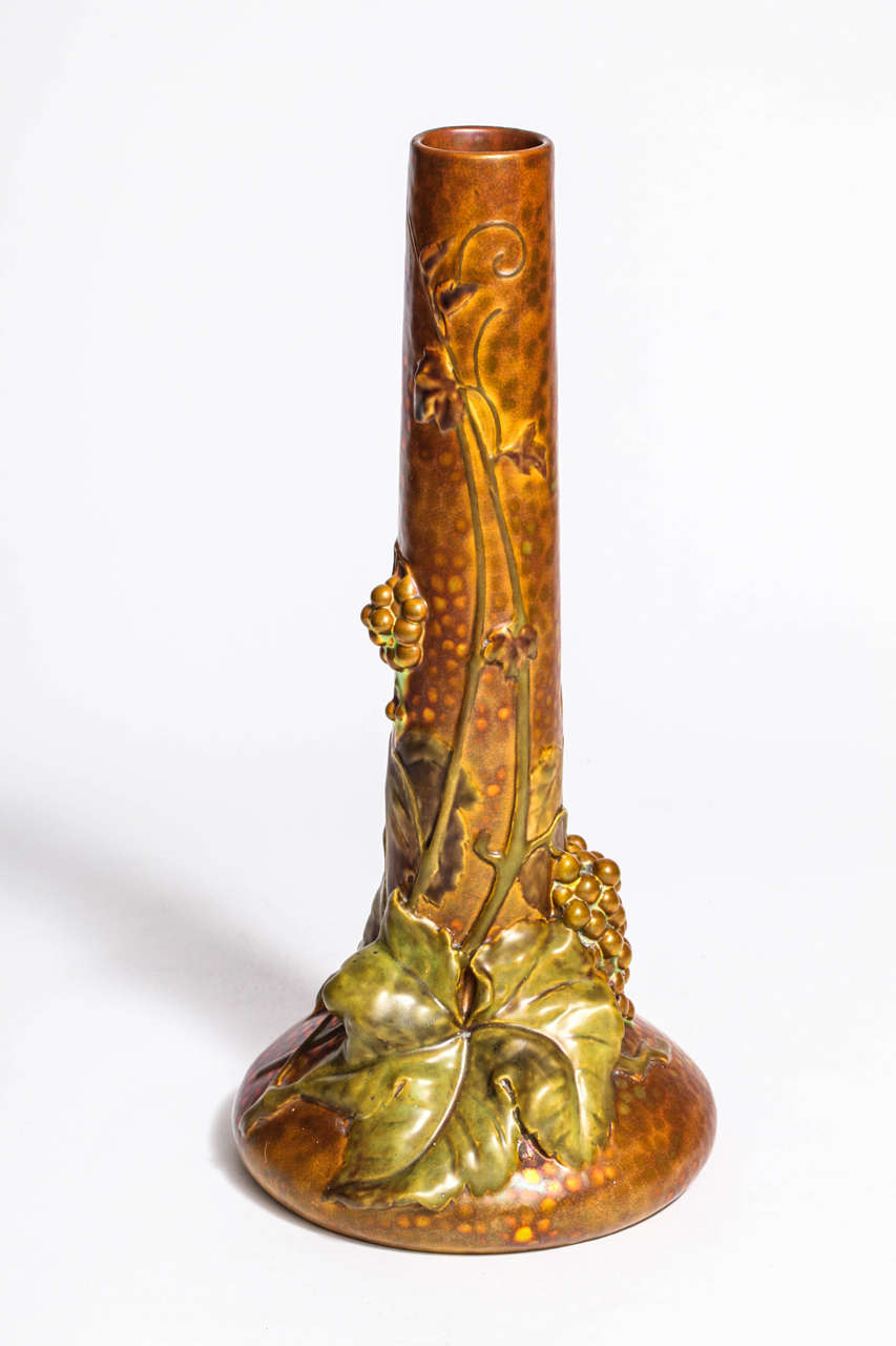 An Art Nouveau Zsolnay eosin glazed earthenware vase with stylized grapes and grape leaves, mint condition, Hungary, circa 1901.