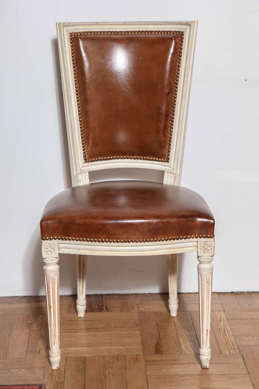 Set of Eight Louis XVI Style Carved and Painted Dining Chairs, France circa 1920