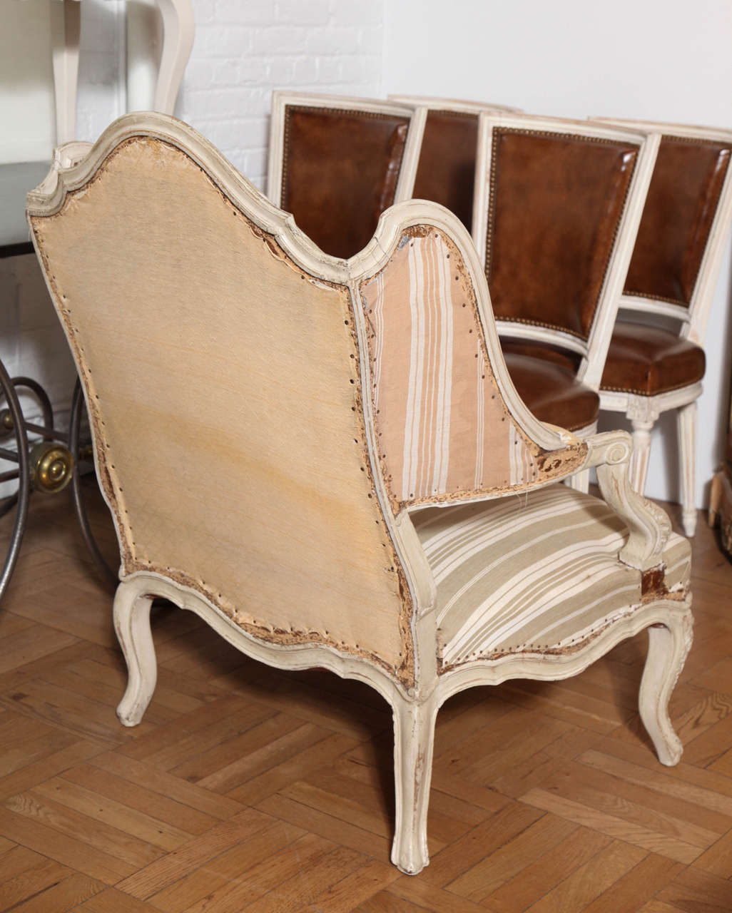 Wood Large Carved and Painted Louis XV Style Wing Back Fauteuil, France circa 1920 For Sale