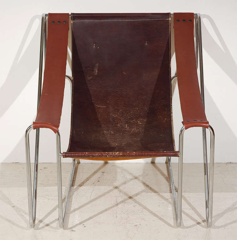 Single leather sling back chair, with chrome metal tube frame.