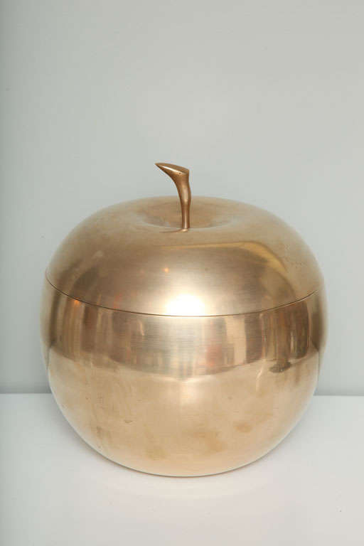 Heavy brass ice bucket in the form of a huge apple, with a polished nickel lining.