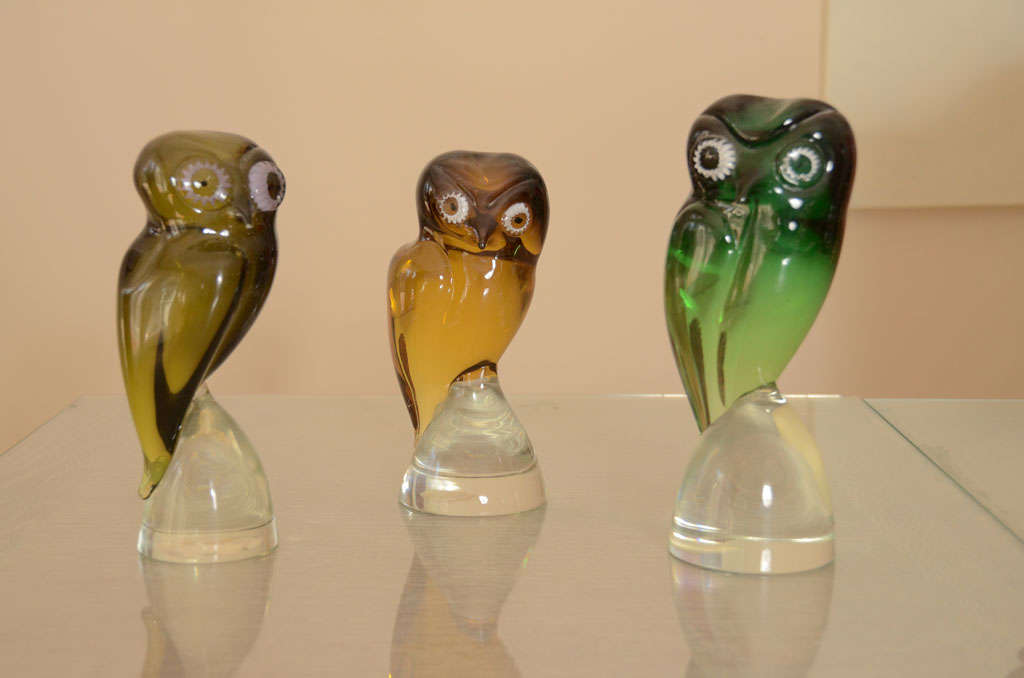 Three  owls in shades of amber, cognac & green. Available individually. Price listed for set of three.