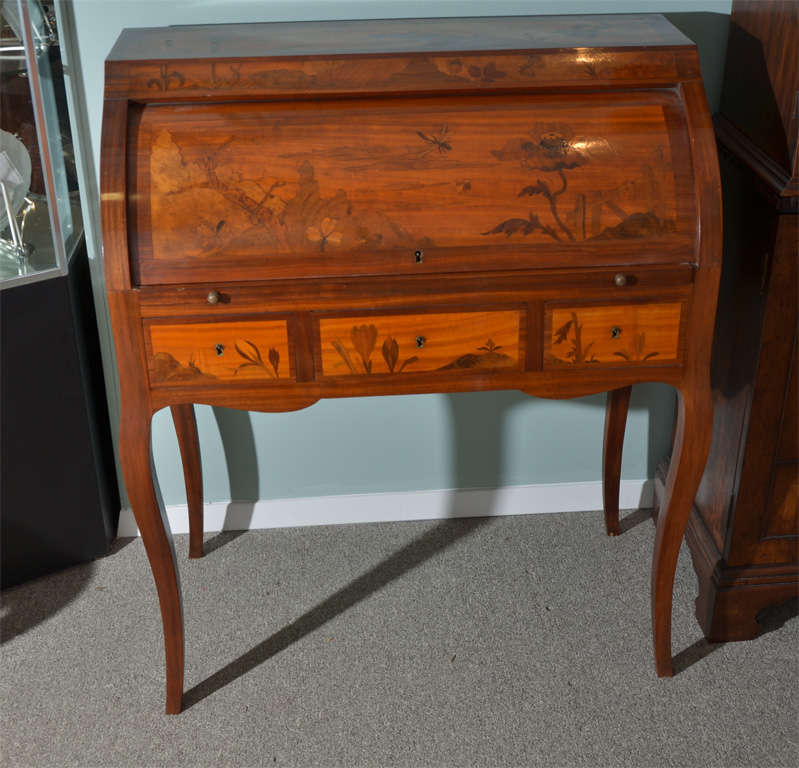 French Art Nouveau marquetry cylinder roll desk with pull out writing surface, four fitted drawers and three in the case.