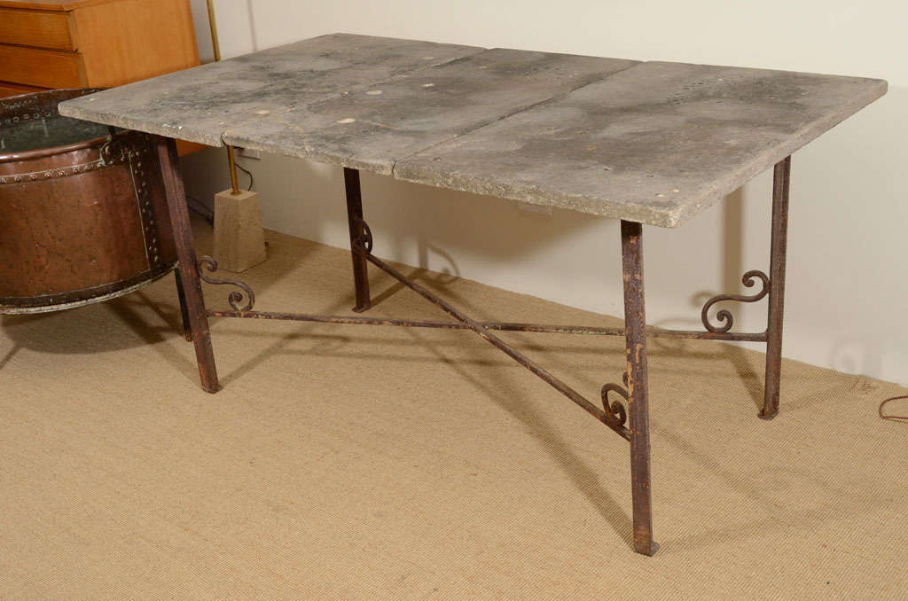 The 3-section top of this one-of-a-kind table is actually white marble that has developed its patina over decades outside.