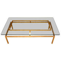 A gilded iron coffee table by Roger Thibier